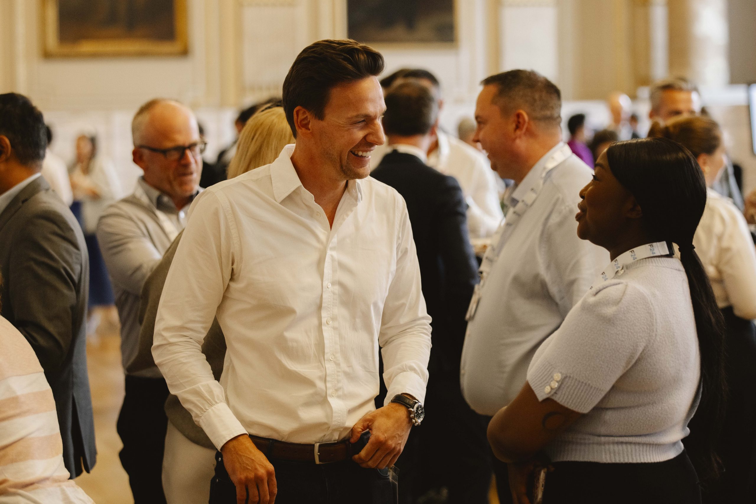 Conference delegates networking and sharing ideas